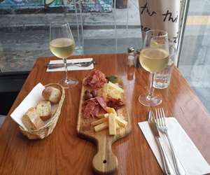 Charcuterie board with wine and bread