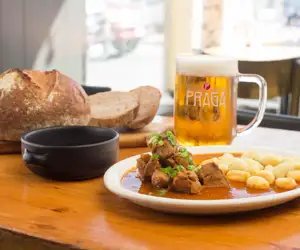 Hungarian goulash with bread and beer at Paprika San Francisco